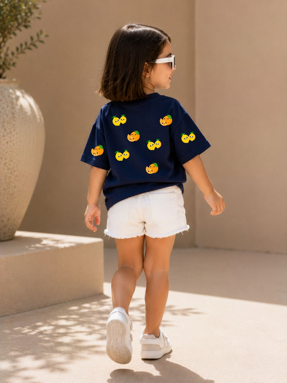 Girls' navy blue oversized drop-shoulder t-shirt with Lemons and Oranges print, view 2 | FLCN